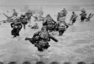 American troops storm Omaha Beach during the Landings, Normandy, France, June 6, 1944.