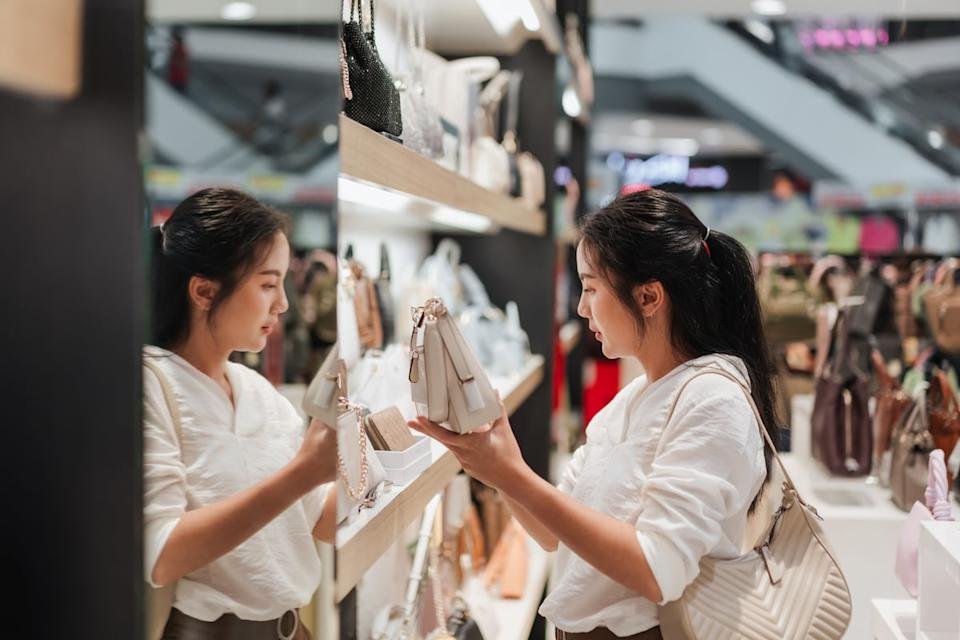 A shopper holding a bag.