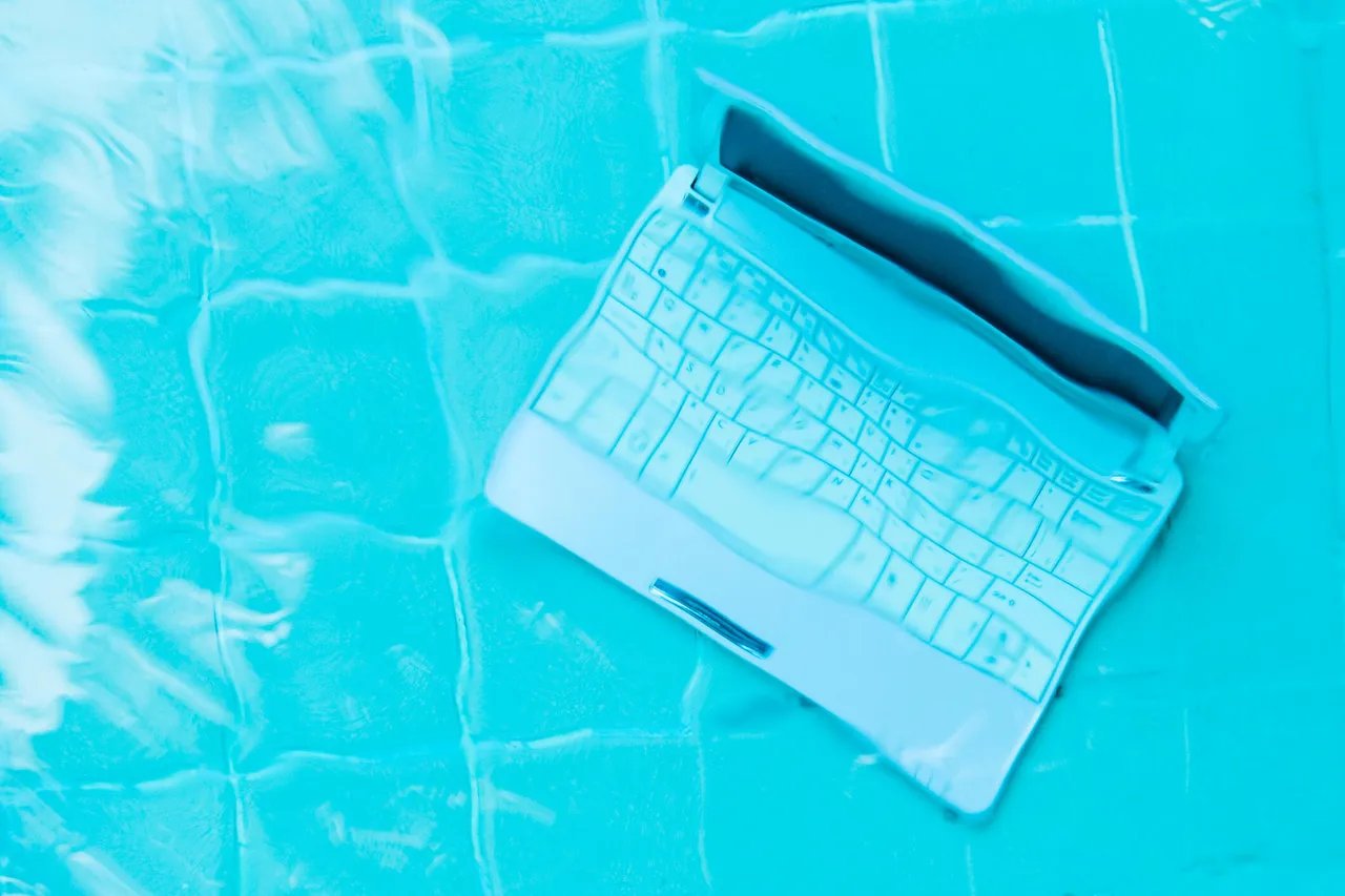 Minicomputer at the bottom of the pool. The concept of a lot of work at work. Blur abstract background