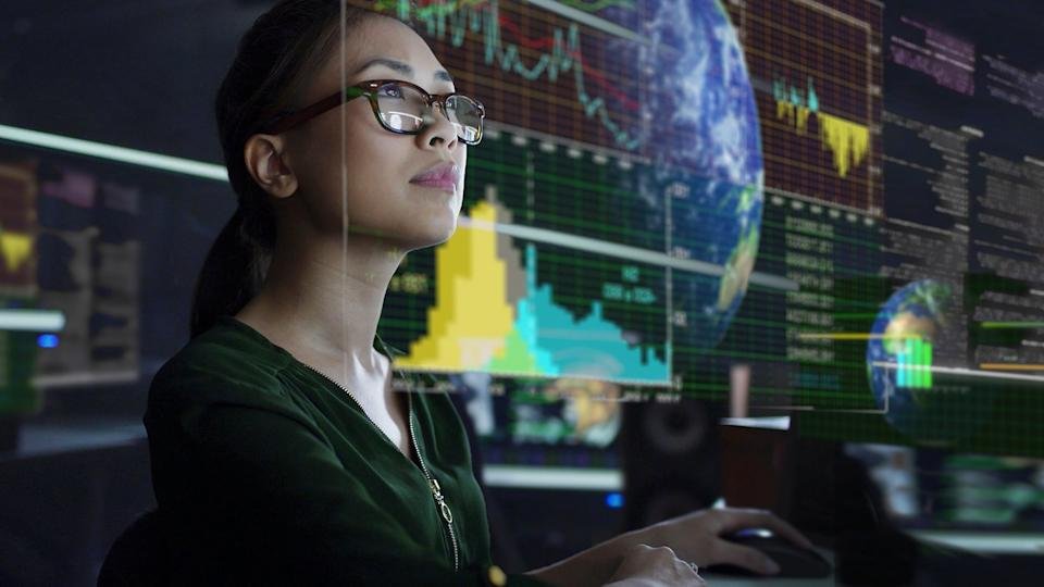 An investor looks at an information dashboard.