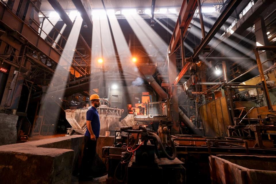 Iranian labourers work in the metal smelting plant, casting and molding of car engine parts, at the Tabriz Tractor Factory, on September 17, 2025, in Tabriz in northwestern Iran. (Photo by ATTA KENARE / AFP) (Photo by ATTA KENARE/AFP via Getty Images)