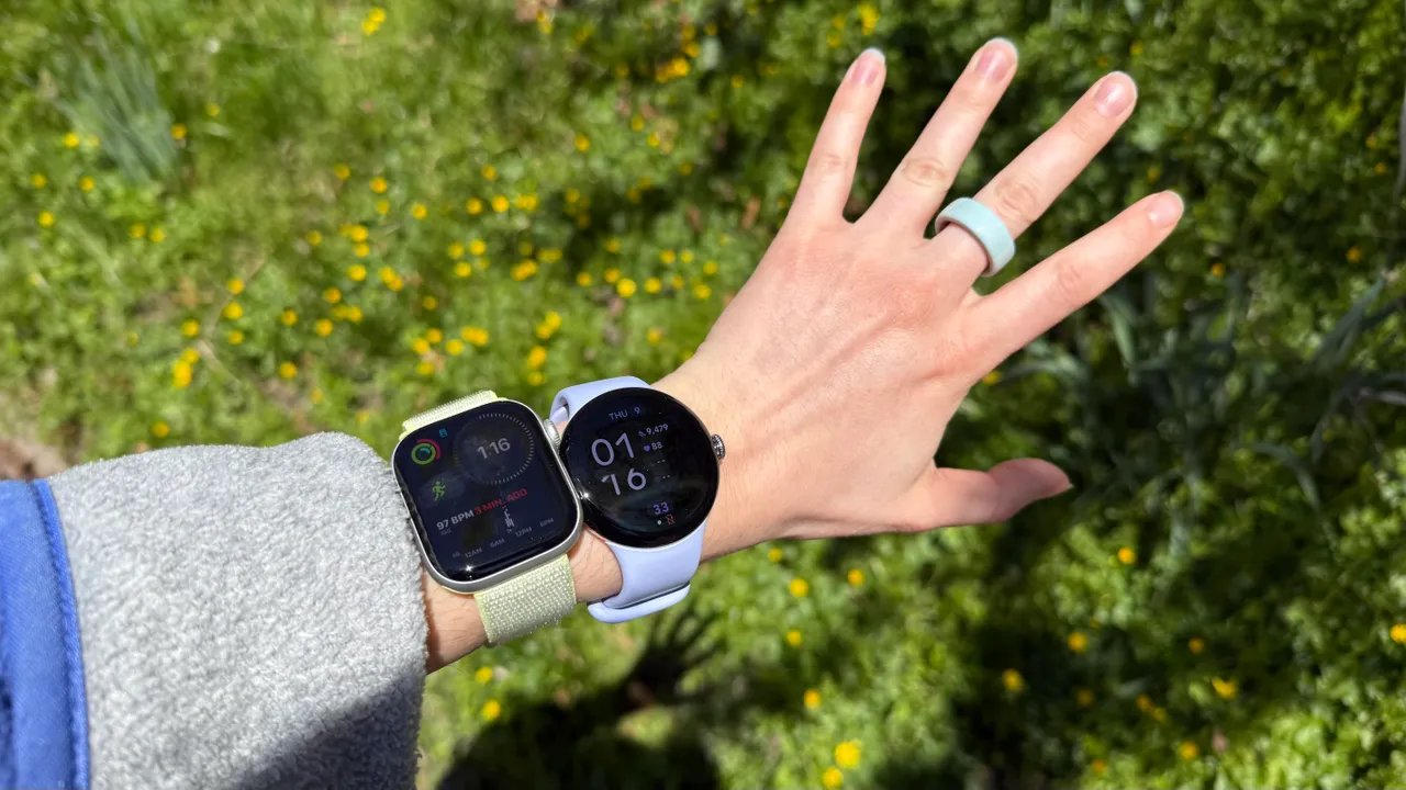 Smartwatches on hand and smart ring on finger